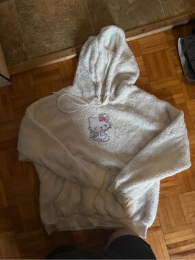 Sanrio Cream Fuzzy Hello Kitty Hoodie with Pink Bow Detail